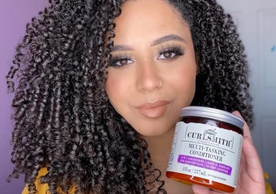 A woman with curlsmith weightless dry cream
