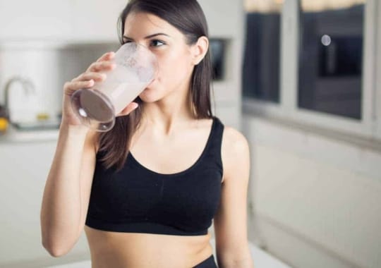 A person drinking protein shake.