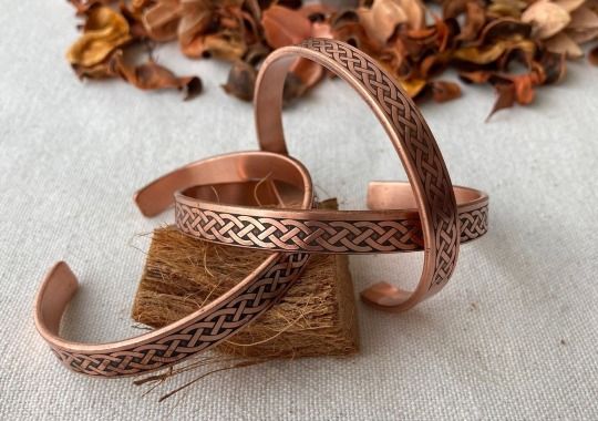 Copper bangle bracelets.