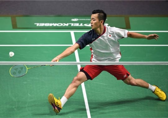 A person playing badminton.