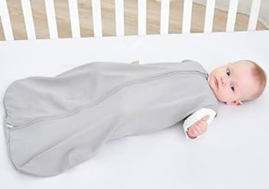 A baby wearing a weighted sleeping sacks.