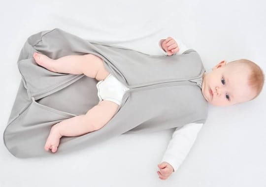 A baby wearing a weighted sleeping sacks.