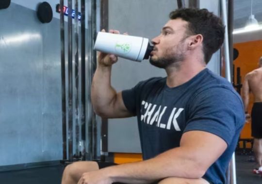 A man drinking whey protein.