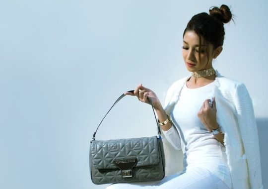 A woman with a handbag.