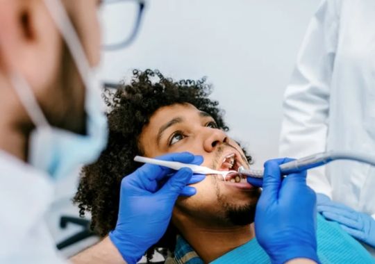 A man undergoing through Temporary Tooth Filling.