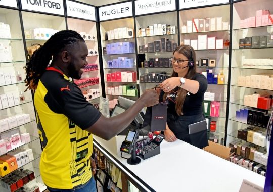 A man buying perfume.