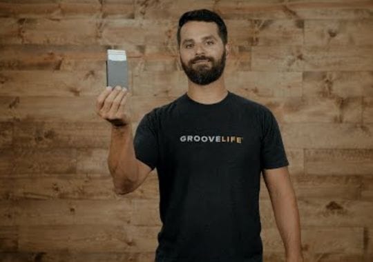 A man holding a groove wallet.