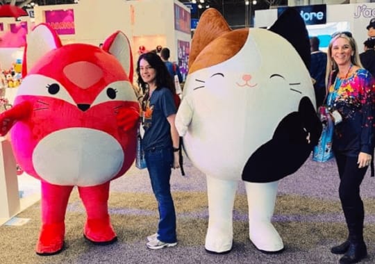 2 women with Squishmallows.