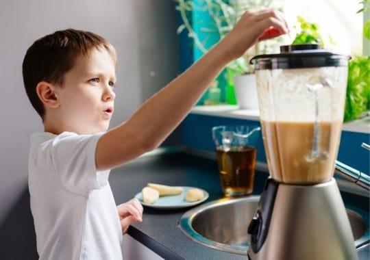 A child making protein shake.