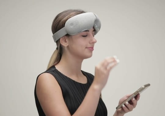 A woman with eye massagers. 