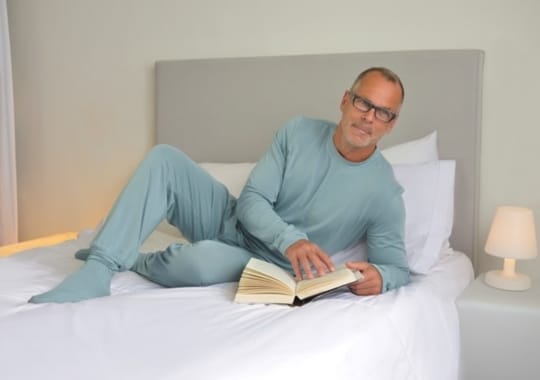 A man wearing bamboo bubby adult PJs.