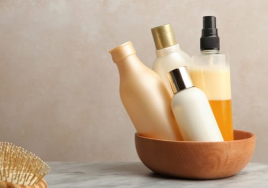 Bottles of products used for washing permed hair.
