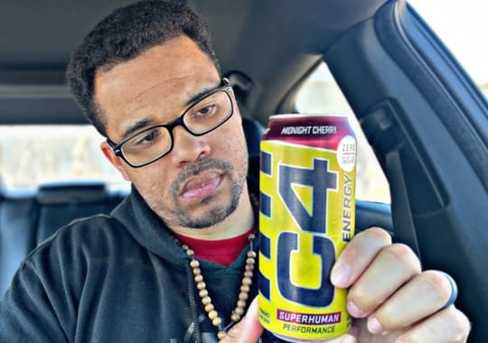 A man holding c4 energy drink.