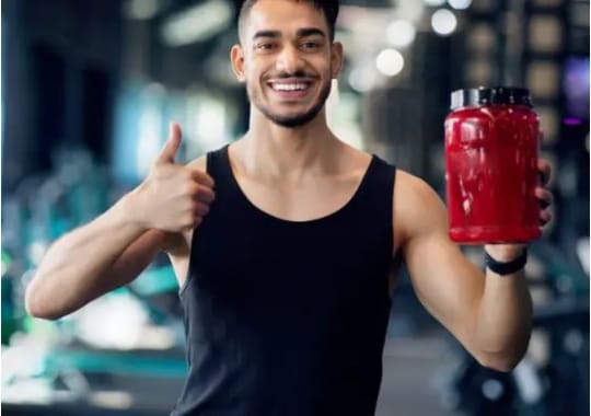 A man holding a bottle of vascular supplement.