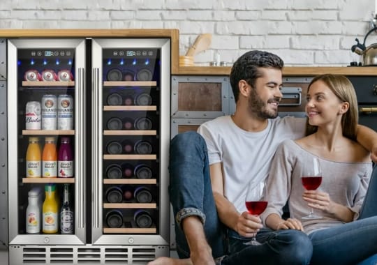  A couple sitting beside a wine cooling cabinet.