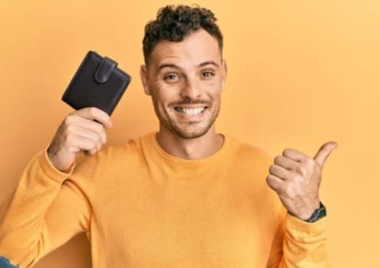 A man holding a wallet.