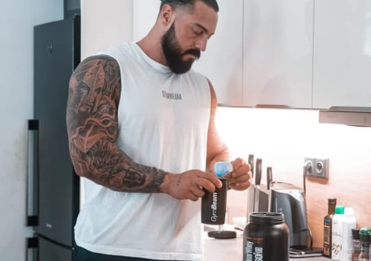A man making Clear Whey Isolate Drink.