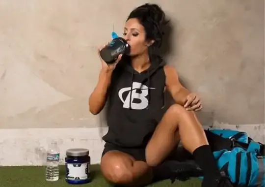 A person drinking creatine supplement.