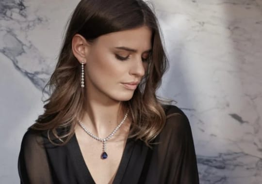 A woman wearing high elegant luxe diamond jewelry.