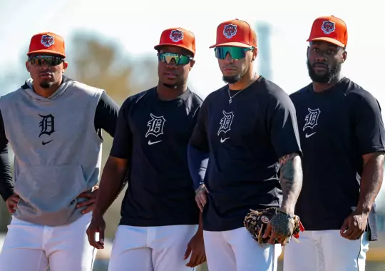 A group of men wearing baseball glasses.