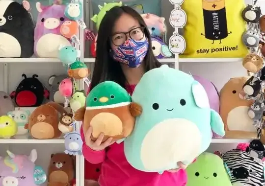 A woman with squishmallows.