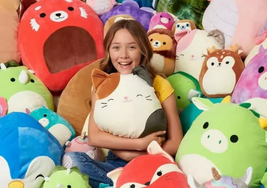 A girl with squishmallows.