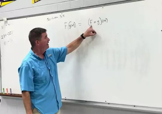An individual instructing in mathematics.