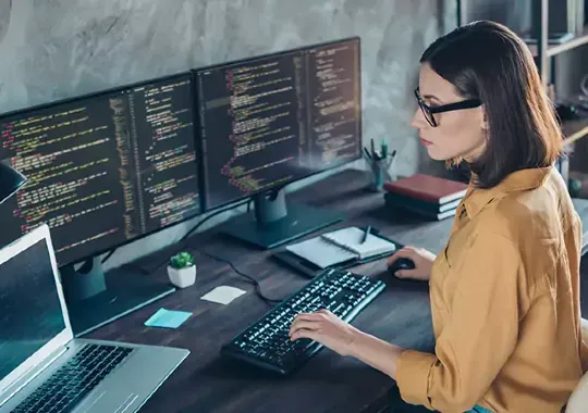 A woman doing computer science.