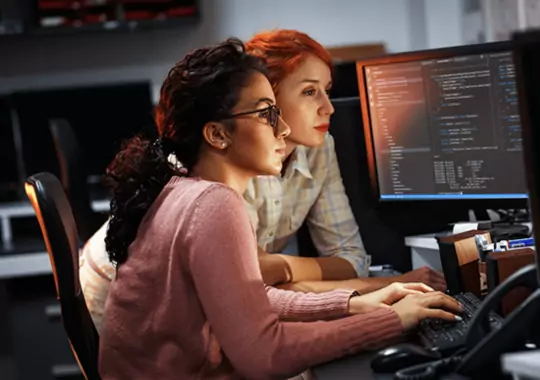 Women doing computer science networking work.