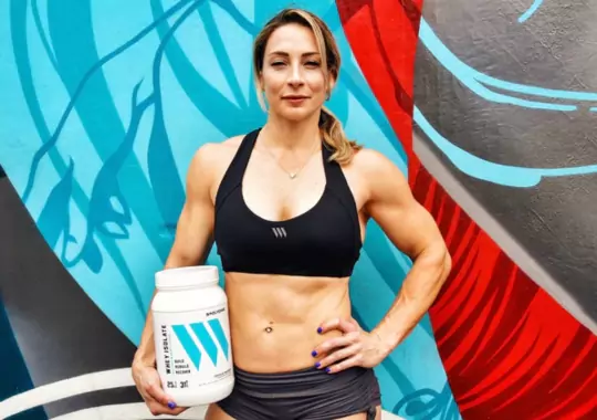 A woman with a tin of clear whey.