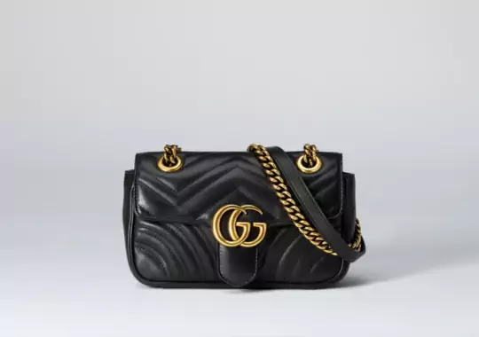 A gucci wallet bag.