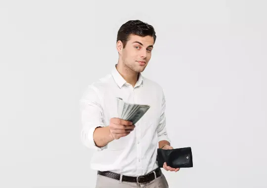 A man dashing out money from his wallet.