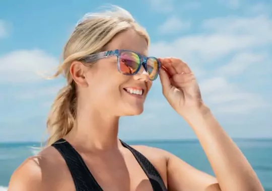 A woman wearing polarized sunglasses.