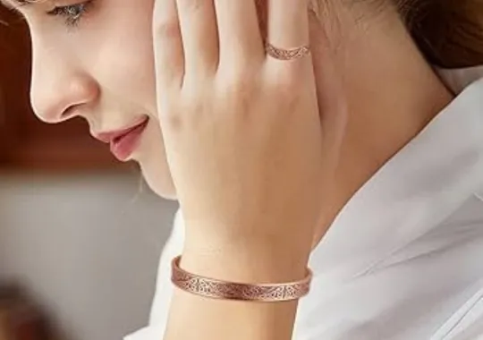 A woman wearing a copper bracelet.