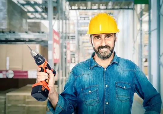 Smiling Handyman with Drill.