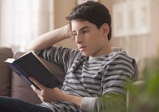 A man reading a book.