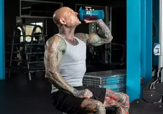 A man drinking protein shake.